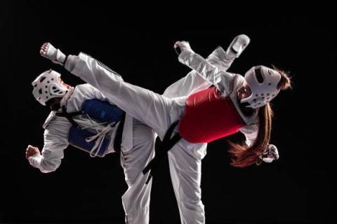 kicking taekwondo practitioners