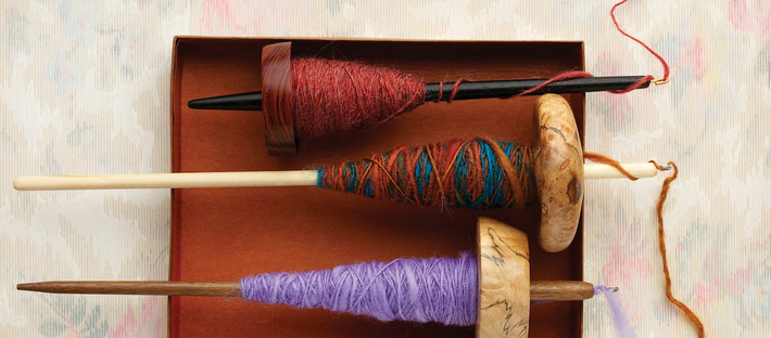 drop spindles with yarn